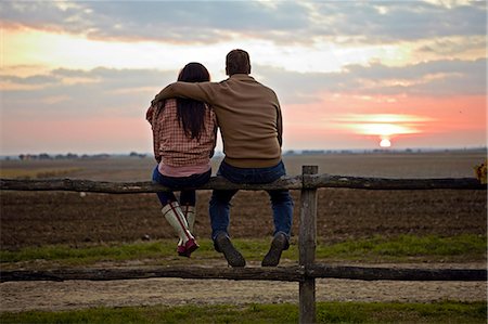 even - Young Couple Sitting On Wooden Fence, Baranja, Croatia, Europe Stock Photo - Premium Royalty-Free, Code: 6115-06733061