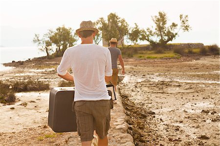 simsearch:6115-06733079,k - Croatia, Dalmatia, Young men carrying luggage, rear view Stock Photo - Premium Royalty-Free, Code: 6115-06733077