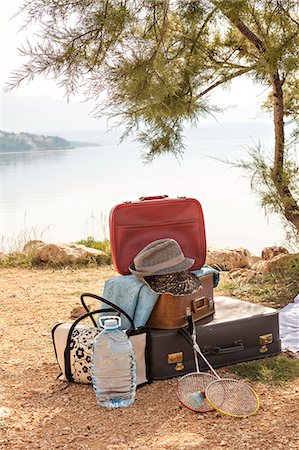 simsearch:6115-06733090,k - Croatia, Dalmatia, At the seaside, luggage in foreground Stock Photo - Premium Royalty-Free, Code: 6115-06733091