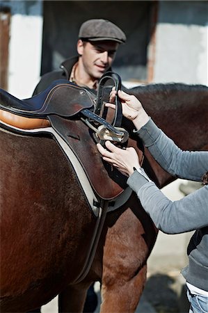 recinto - Person Saddles A Horse, Close-up, Baranja, Croatia, Europe Fotografie stock - Premium Royalty-Free, Codice: 6115-06733033