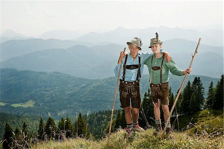 Germany, Bavaria, Two boys in traditional clothing standing arm in arm in mountains Stockbilder - Premium RF Lizenzfrei, Bildnummer: 6115-06733166