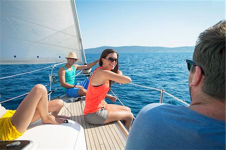 Croatia, Adriatic Sea, Young people on sailboat relaxing Photographie de stock - Premium Libres de Droits, Code: 6115-06733126