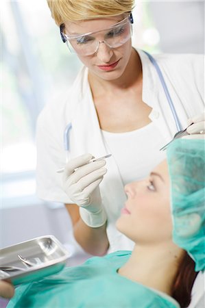 plastic surgery woman face - Patient Getting A Cosmetic Surgery Treatment Stock Photo - Premium Royalty-Free, Code: 6115-06733250