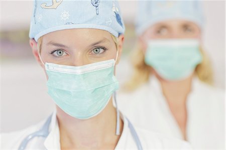 surgeon portrait - Doctor and Nurse Wearing Surgical Masks Stock Photo - Premium Royalty-Free, Code: 6115-06733260