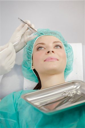 female doctor cap - Patient In Treatment Stock Photo - Premium Royalty-Free, Code: 6115-06733270