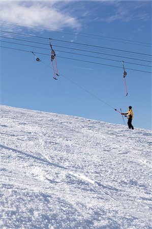 simsearch:6115-06967096,k - Young woman on a ski lift, Sudelfeld, Bavaria, Germany Stock Photo - Premium Royalty-Free, Code: 6115-06966979