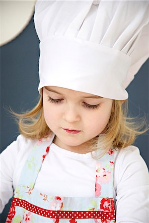 simsearch:6115-07109681,k - Little girl with chef's hat, Munich, Bavaria, Germany Stock Photo - Premium Royalty-Free, Code: 6115-06966923