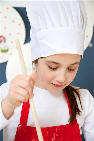 simsearch:6115-07109681,k - Little girl with chef's hat preparing dough, Munich, Bavaria, Germany Stock Photo - Premium Royalty-Free, Code: 6115-06966920