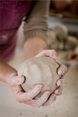 Craftswoman kneading clay ball, Bavaria, Germany, Europe Photographie de stock - Premium Libres de Droits, Code: 6115-06967127
