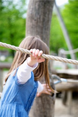 simsearch:6115-07109681,k - Girl playing on ropes in the playground, Munich, Bavaria, Germany Stock Photo - Premium Royalty-Free, Code: 6115-07109666