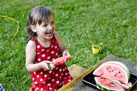 simsearch:6115-07109681,k - Girl eating water melon, Munich, Bavaria, Germany Stock Photo - Premium Royalty-Free, Code: 6115-07109681