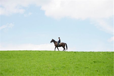 fields scenic low angle - Woman Riding Horse in Rural Landscape, Baden Wuerttemberg, Germany, Europe Stock Photo - Premium Royalty-Free, Code: 6115-07109620