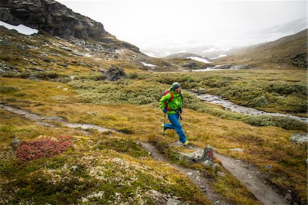 Man speed hiking along mountain trail, Norway, Europe Stock Photo - Premium Royalty-Free, Code: 6115-07109758
