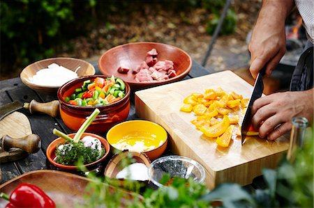 preparing vegetables - Person Cutting Bell Pepper Stock Photo - Premium Royalty-Free, Code: 6115-07282748