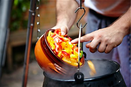 pouring - Person Adding Vegetable In Cooking Pot Stock Photo - Premium Royalty-Free, Code: 6115-07282756