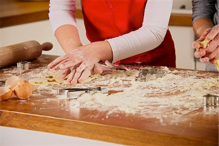 Children making Christmas cookies, Munich, Bavaria, Germany Stock Photo - Premium Royalty-Free, Code: 6115-07282716