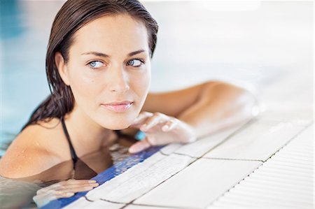 simsearch:6115-07282835,k - Young woman in swimming pool relaxing, Dubrovnik, Croatia Stock Photo - Premium Royalty-Free, Code: 6115-07282865