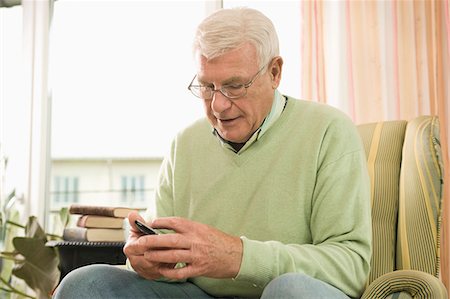 sequenced - Senior man using phone in nursing home, Bavaria, Germany Stock Photo - Premium Royalty-Free, Code: 6115-07539799