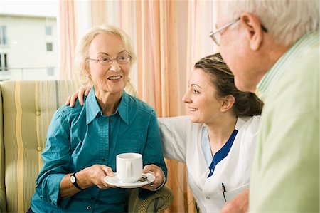 Senior couple with nurse in nursing home, Bavaria, Germany Photographie de stock - Premium Libres de Droits, Code: 6115-07539800