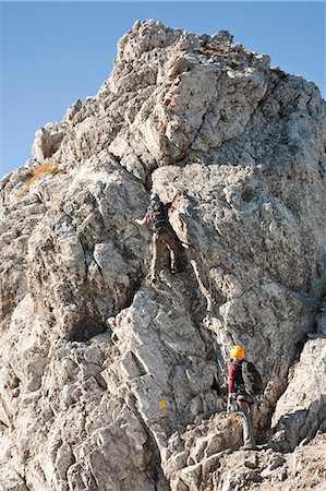 Two female alpinists rock climbing, Innsbruck route, Tyrol, Austria Stock Photo - Premium Royalty-Free, Code: 6115-07539824