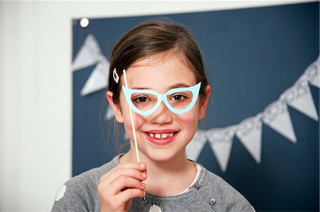 face of carnival - Girl in fancy dress and glasses, Munich, Bavaria, Germany Stock Photo - Premium Royalty-Free, Code: 6115-08066242