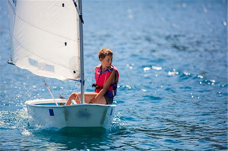 simsearch:6102-08063046,k - Boy in a sailboat, Hvar island, Croatia Photographie de stock - Premium Libres de Droits, Code: 6115-08066407
