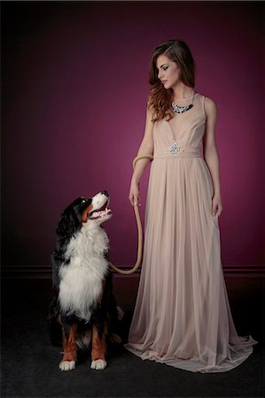 simsearch:6115-08066527,k - Young woman in evening gown with dog Stock Photo - Premium Royalty-Free, Code: 6115-08066536