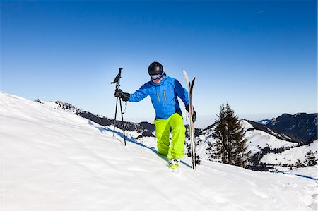 racchetta da sci - Ski holiday, Skier hiking uphill, Sudelfeld, Bavaria, Germany Fotografie stock - Premium Royalty-Free, Codice: 6115-08149347