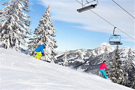simsearch:6115-06967096,k - Ski holiday, Skiers carving on ski slope, Sudelfeld, Bavaria, Germany Stock Photo - Premium Royalty-Free, Code: 6115-08149323