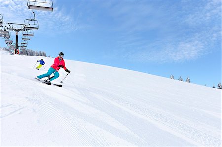 reto - Ski holiday, Skiers carving downhill, Sudelfeld, Bavaria, Germany Photographie de stock - Premium Libres de Droits, Code: 6115-08149324