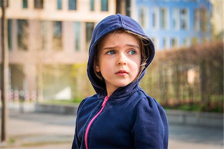 person thinking uncertain - Blonde girl with hooded sweater, Munich, Bavaria, Germany Stock Photo - Premium Royalty-Free, Code: 6115-08100476