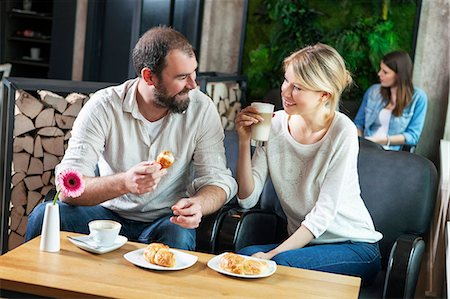 simsearch:6115-08104867,k - Couple flirting in a cafe, people in background Stock Photo - Premium Royalty-Free, Code: 6115-08100507