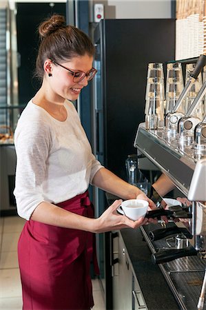 simsearch:6115-08100746,k - Waitress working at coffee machine Stock Photo - Premium Royalty-Free, Code: 6115-08100535