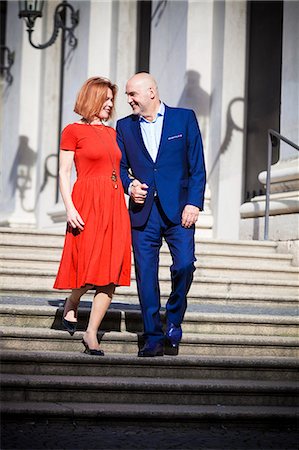 Senior couple walking down staircase, Munich, Bavaria, Germany Stock Photo - Premium Royalty-Free, Code: 6115-08100680