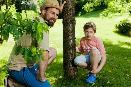 simsearch:6115-08100619,k - Father and son in the garden, Munich, Bavaria, Germany Stock Photo - Premium Royalty-Free, Code: 6115-08100609