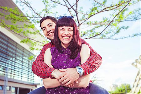 Young man embracing girlfriend, Osijek, Croatia Stock Photo - Premium Royalty-Free, Code: 6115-08100711