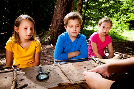education camp - Children crafting in a forest camp, Munich, Bavaria, Germany Stock Photo - Premium Royalty-Free, Code: 6115-08100808