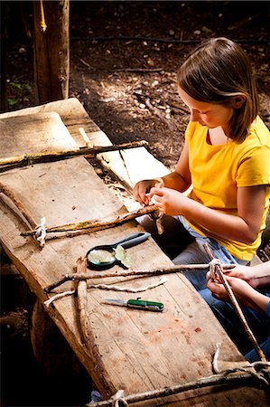 simsearch:6115-06732782,k - Girl crafting in a forest camp, Munich, Bavaria, Germany Photographie de stock - Premium Libres de Droits, Code: 6115-08100810