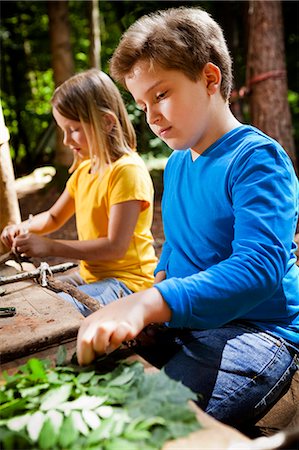 education camp - Children crafting in a forest camp, Munich, Bavaria, Germany Stock Photo - Premium Royalty-Free, Code: 6115-08100812