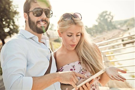 simsearch:6115-08100857,k - Young couple with digital tablet on sighteeing tour Stock Photo - Premium Royalty-Free, Code: 6115-08100928