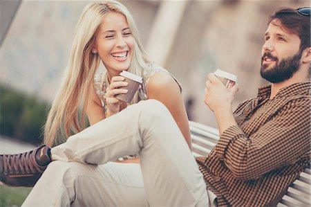 simsearch:6115-08100777,k - Happy young couple having a cup of coffee outdoors Photographie de stock - Premium Libres de Droits, Code: 6115-08100933