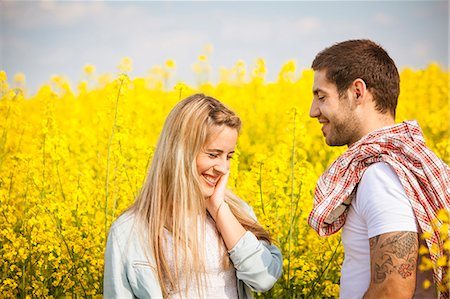 simsearch:6115-08101193,k - Happy young couple standing in colza field, Tuscany, Italy Stock Photo - Premium Royalty-Free, Code: 6115-08101049