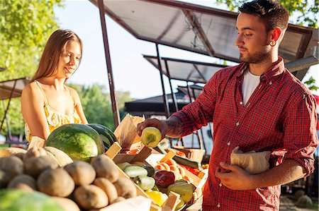 farmers market female - Male customer buying vegetables at market stall Stock Photo - Premium Royalty-Free, Code: 6115-08101190