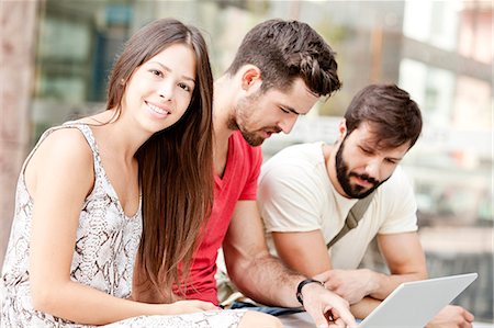 student male computer - Group of university students using laptop together Stock Photo - Premium Royalty-Free, Code: 6115-08101110