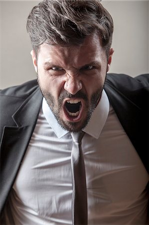 excited man yelling - Portrait of businessman screaming Stock Photo - Premium Royalty-Free, Code: 6115-08104962