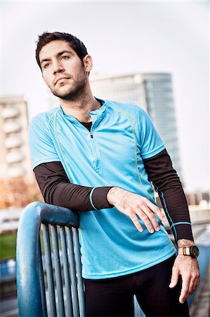 exhausted training - Male runner takes a break in city Stock Photo - Premium Royalty-Free, Code: 6115-08105047