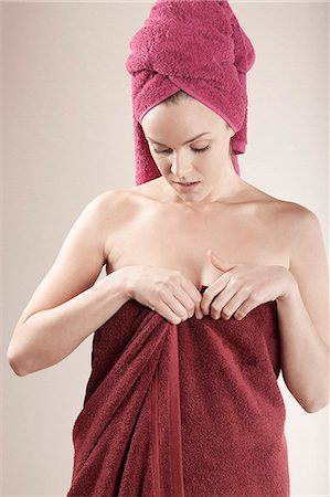 Young woman wrapped in towel Stock Photo - Premium Royalty-Free, Code: 6115-08105067