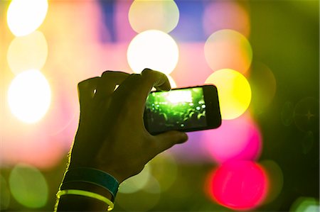 raising hand in a crowd - Young people having fun at music concert Stock Photo - Premium Royalty-Free, Code: 6115-08105218