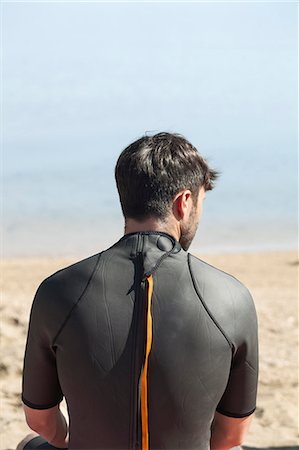 simsearch:6115-08239316,k - Young man wearing wetsuit Foto de stock - Sin royalties Premium, Código: 6115-08239221