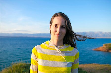 simsearch:6115-08239929,k - Portrait of woman at the seaside Stock Photo - Premium Royalty-Free, Code: 6115-08239353